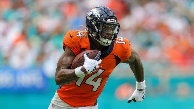Sep 24, 2023; Miami Gardens, Florida, USA; Denver Broncos wide receiver Courtland Sutton (14) runs with the ball against the Miami Dolphins in the third quarter at Hard Rock Stadium.
